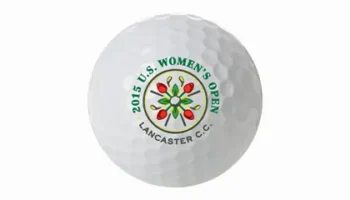 A White Golf Ball Featuring The Logo And Text 2015 U.S. Women’s Open, Lancaster C.C. Along With A Colorful Flower-like Design In The Center.